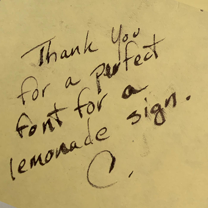 Sticky note about Zachary Font, and a lemonade sign